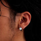 model wearing unisex opal hoop earrings minimalist style
