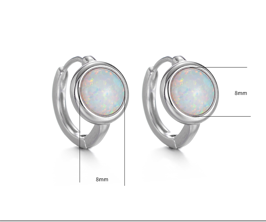 macro shot of minimalist opal ear hoop texture