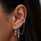 Close-up of an ear with multiple S925 Sterling Silver Petra Stacked Illusion Earringsearrings against a blurred background