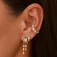 S925 Sterling Silver Petra Stacked Illusion EarringsClose-up of an ear wearing gold earrings with small stones.