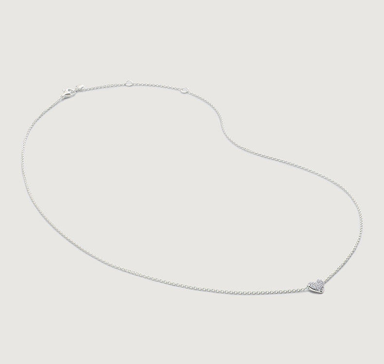 “S925 sterling silver sliding heart pendant necklace flat lay on white background”