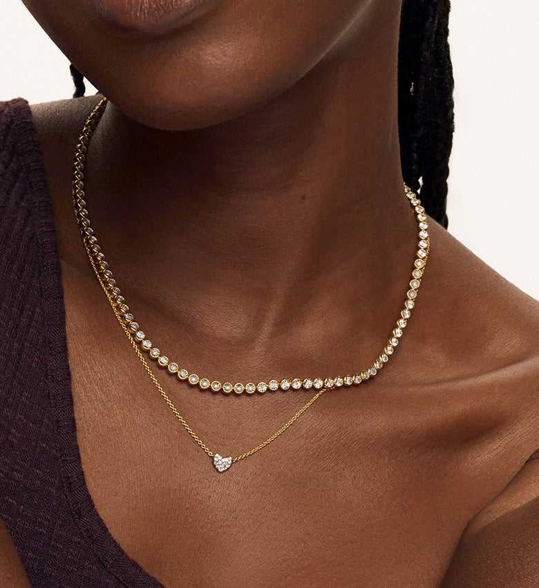 “Female model wearing sliding heart necklace with sparkling zircon pendant”