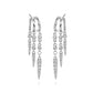 S925 Sterling Silver Spike Stud EarringsSilver hoop earrings with dangling diamond accents on a white background