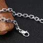 Silver chain with clasp on a dark textured background