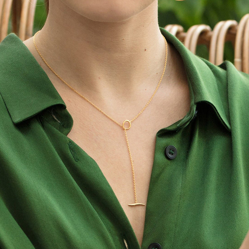 Woman Wearing Minimalist Silver OT Necklace