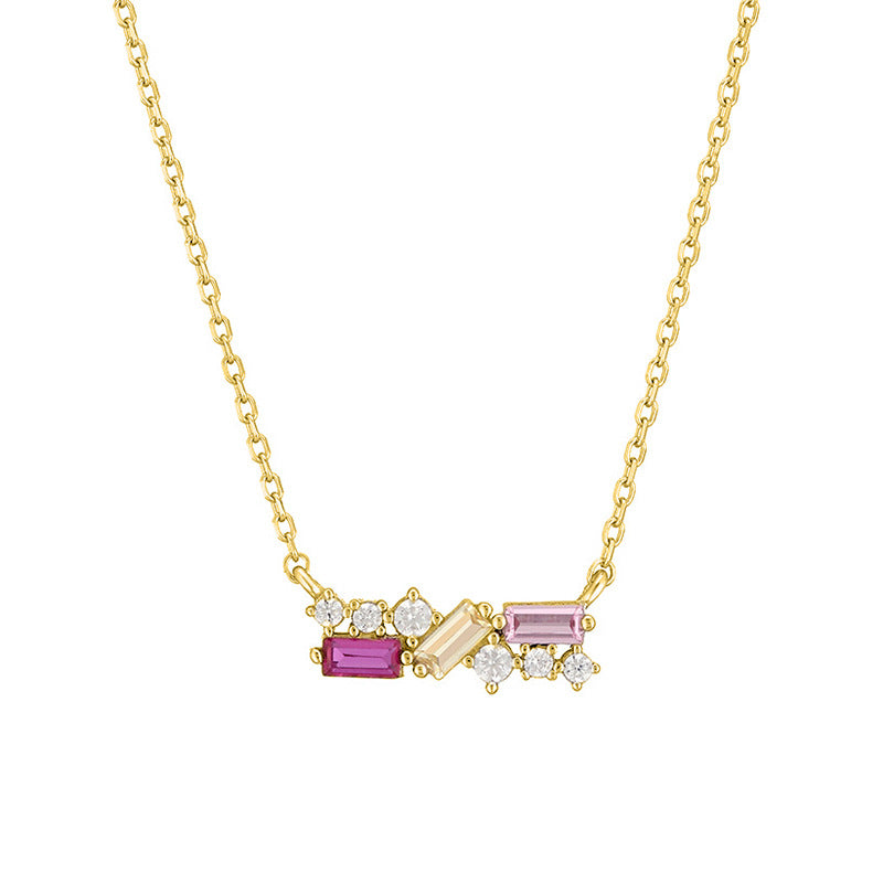 Gold necklace with gemstone pendants on a white background
