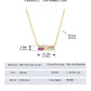 Gold necklace with gemstones and measurement details on a white background