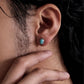 model wearing minimalist turquoise stud earrings unisex style
