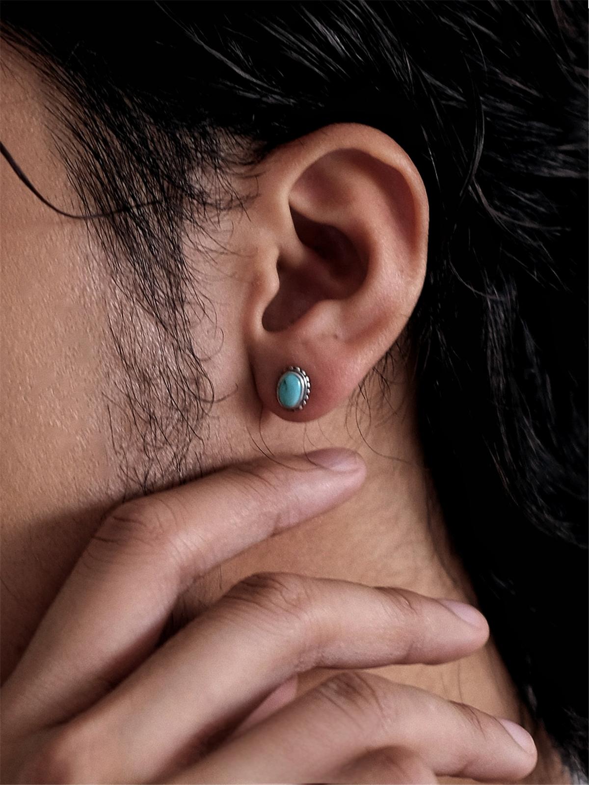 model wearing minimalist turquoise stud earrings unisex style