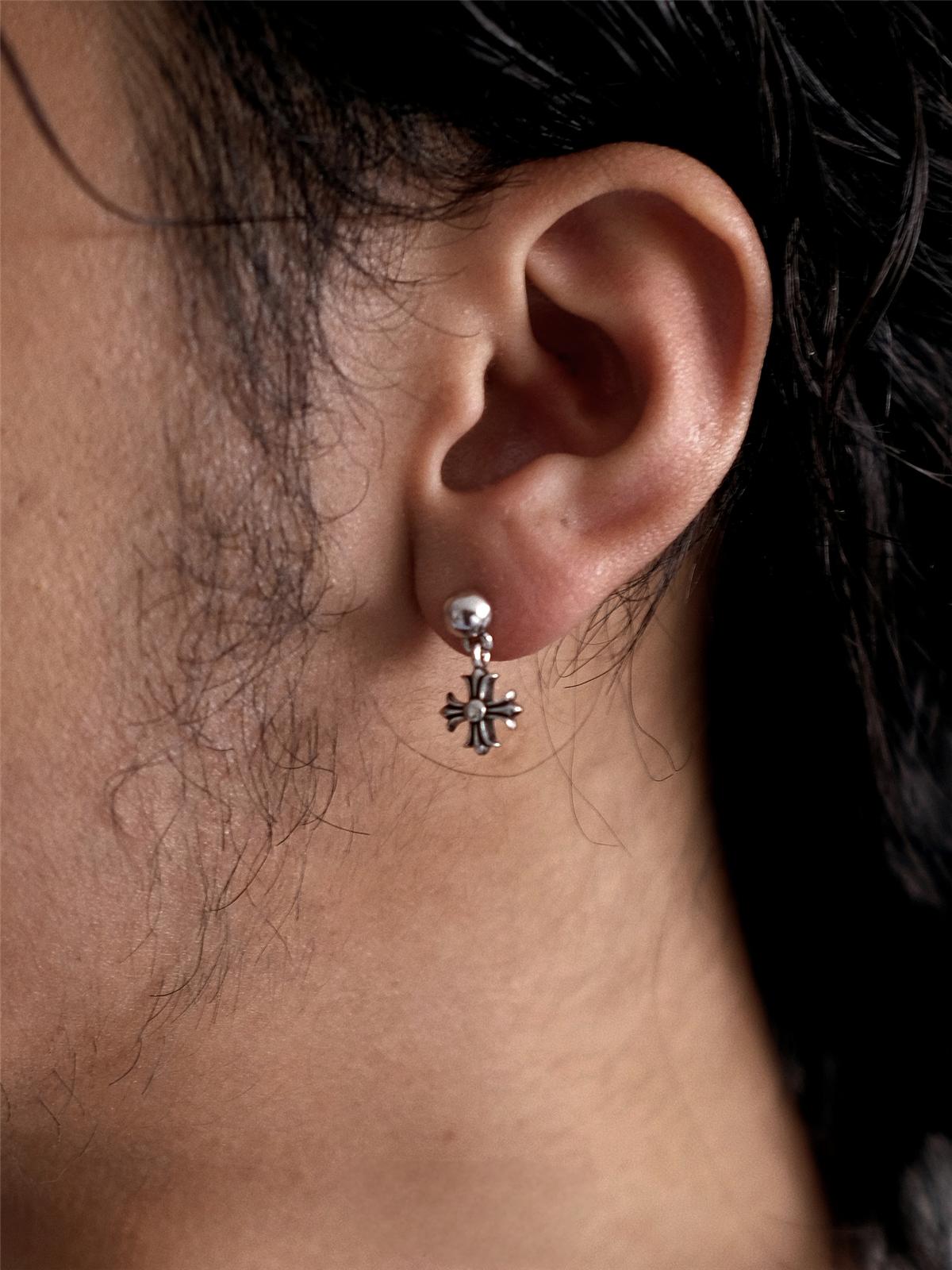 unisex sterling silver cross dangle earring styled with gothic fashion