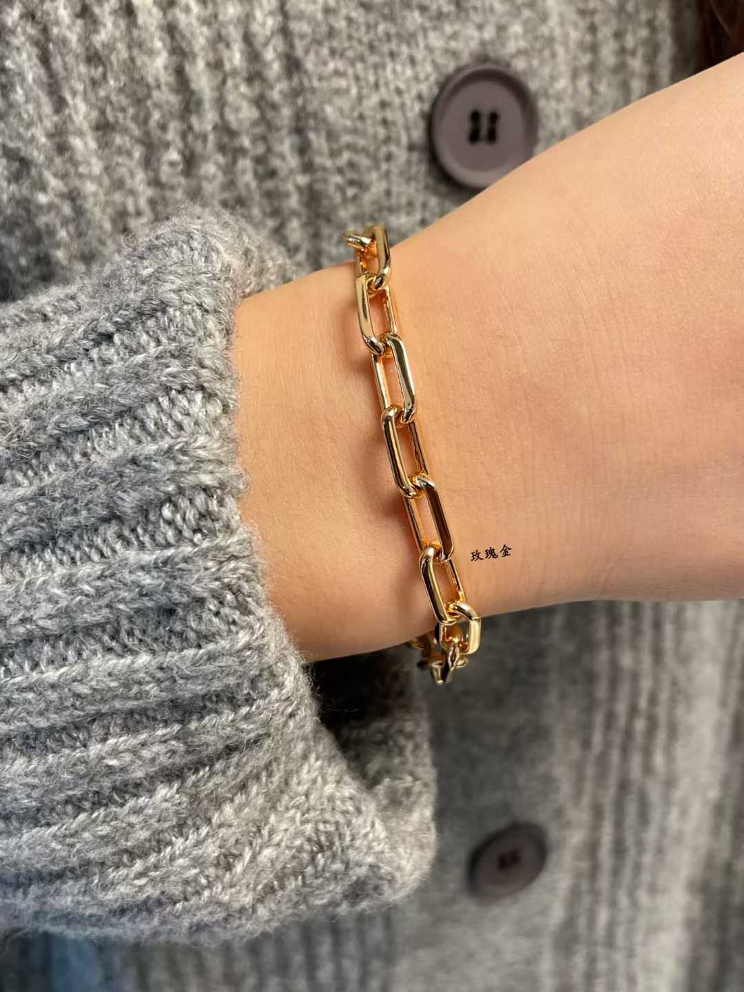 “Model wearing Santos de Cartier medium chain bracelet”