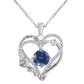 Heart-shaped silver pendant with blue gemstone and 'I love you' engraving on a white background