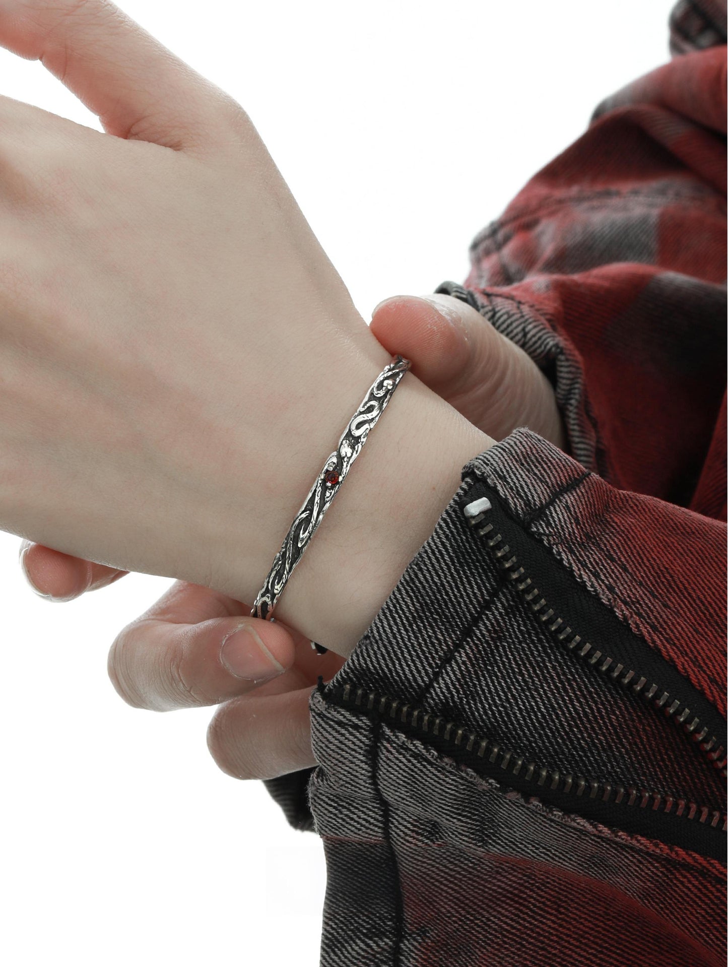 "Model wearing sleek unisex silver serpent bracelet styled in minimalist fashion"
