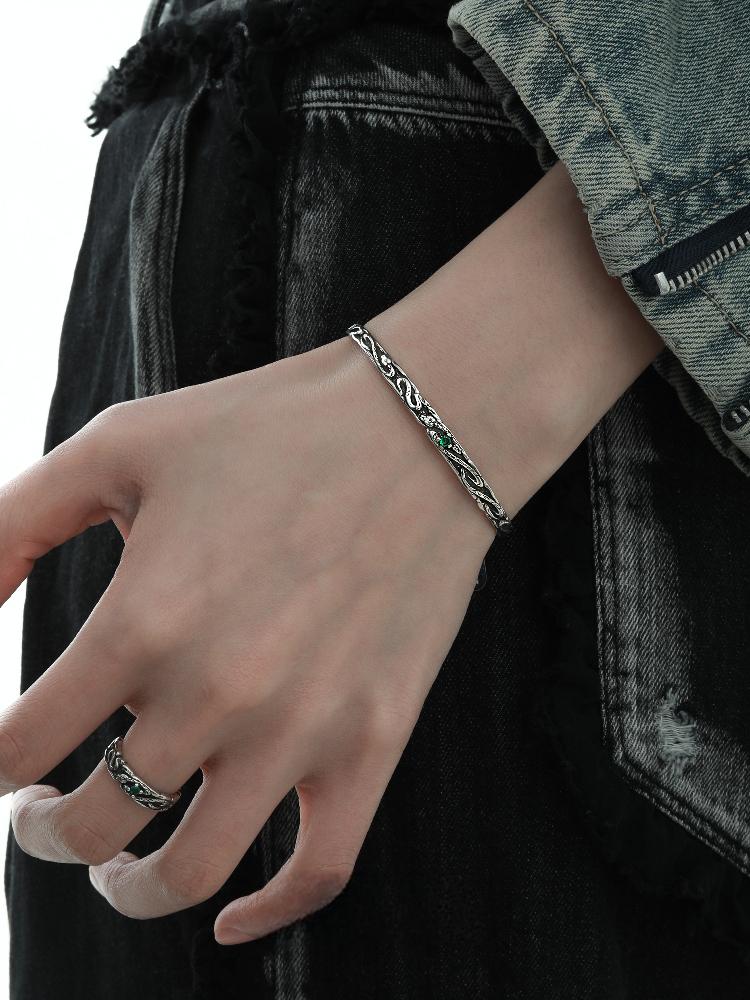 "Serpent silver bangle worn on wrist showing unisex adjustable fit"