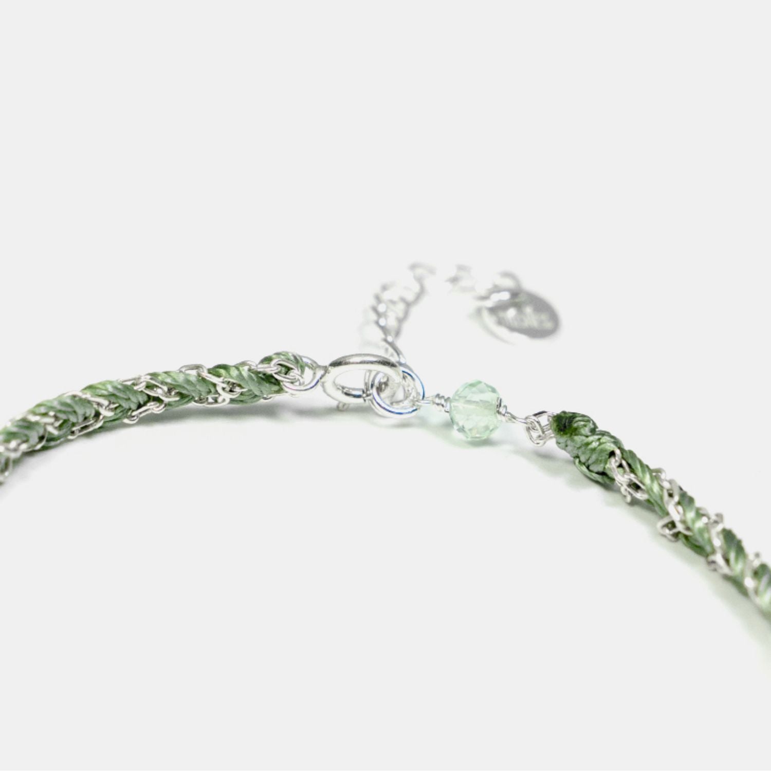 Green beaded bracelet on a white background