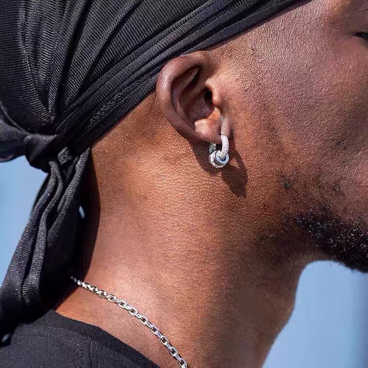 model wearing star orbit sterling silver earrings, minimalist luxury look