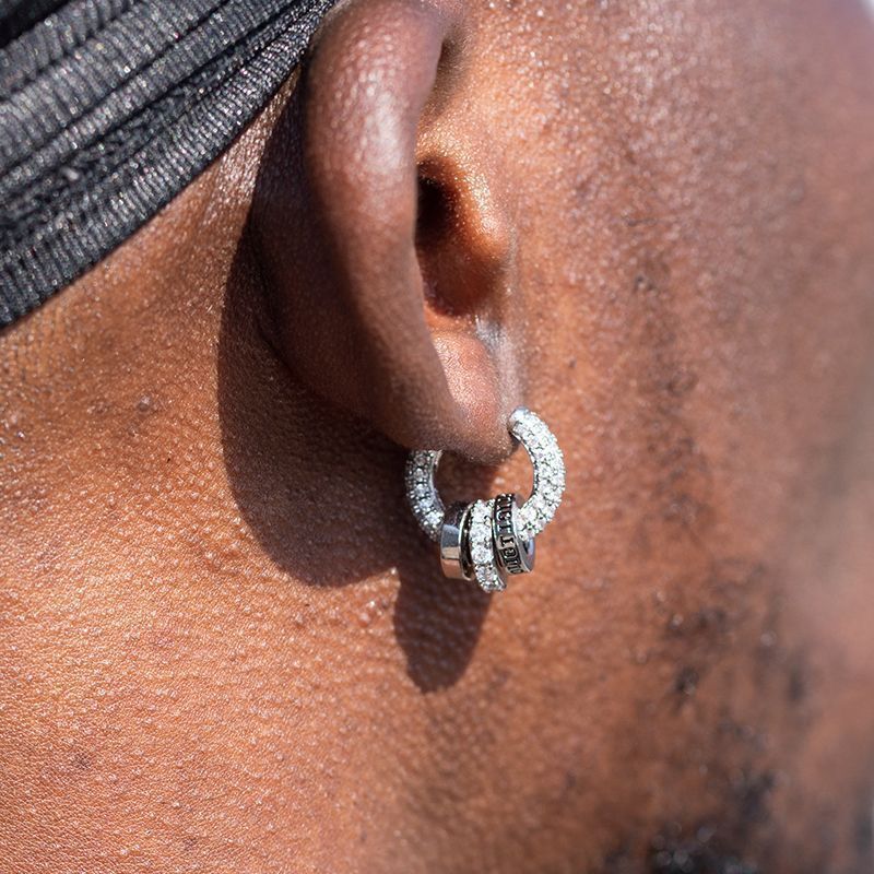model wearing star orbit sterling silver earrings, minimalist luxury look