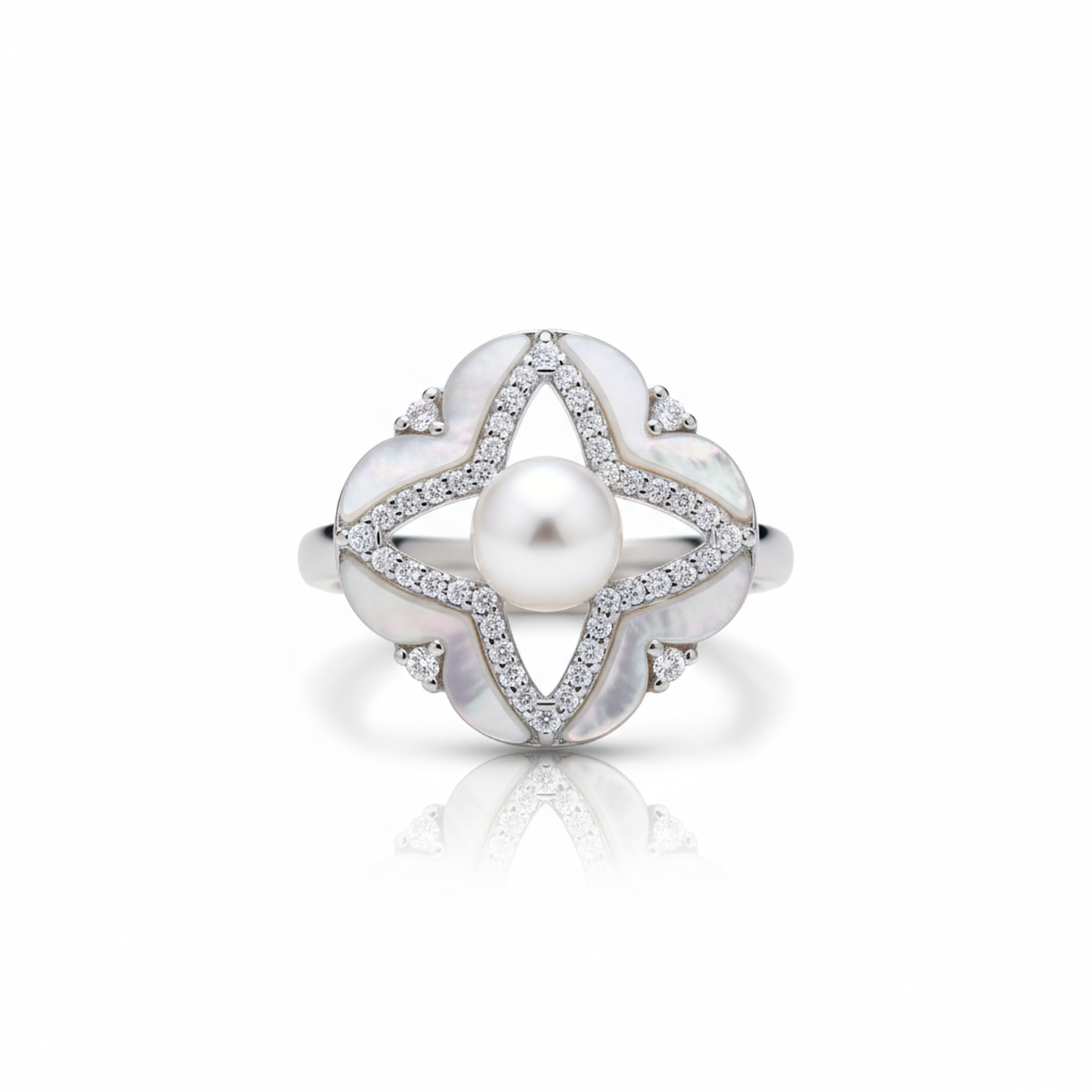Silver ring with a pearl and diamond accents on a white background