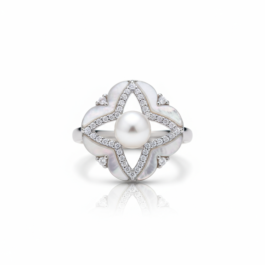 Silver ring with a pearl and diamond accents on a white background
