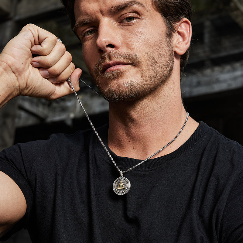 “Model wearing men’s Eye of Horus sterling silver necklace street style look”