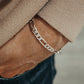 "Male model wearing minimalist Figaro silver bracelet with casual streetwear"