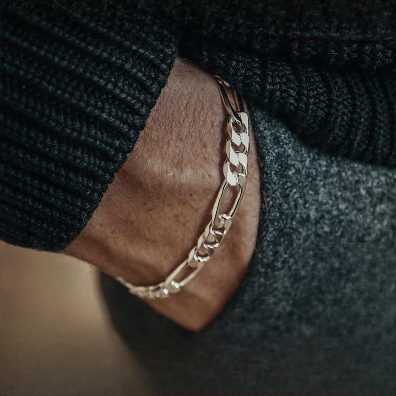 "Male model wearing minimalist Figaro silver bracelet with casual streetwear"