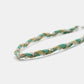 Braided bracelet with green and beige strands on a white background