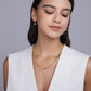 Model wearing the necklace alone on bare skin.