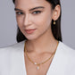 Model wearing the necklace alone on bare skin.
