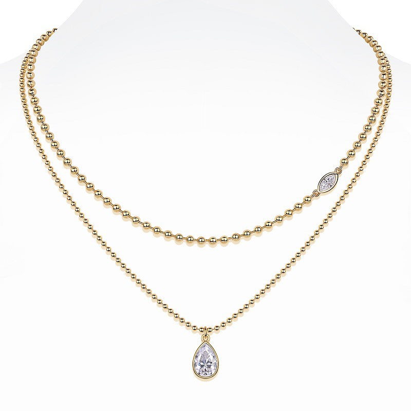 High-definition shot of both necklaces laid flat together on pure white background, arranged to show the layered effect.