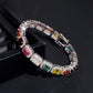  Straight-on to clearly showcase the full rainbow sequence of colored gemstones in continuous pave.