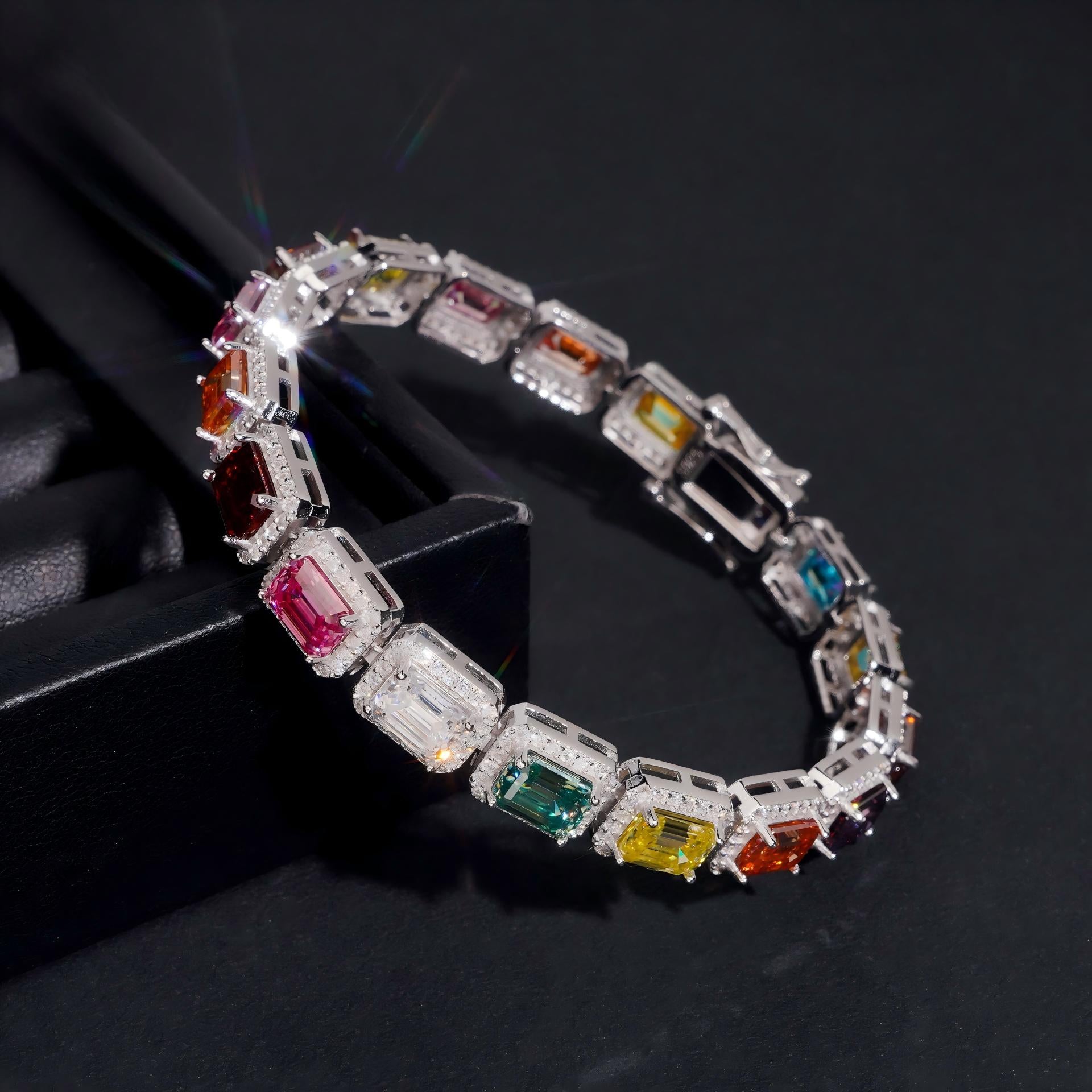  Straight-on to clearly showcase the full rainbow sequence of colored gemstones in continuous pave.