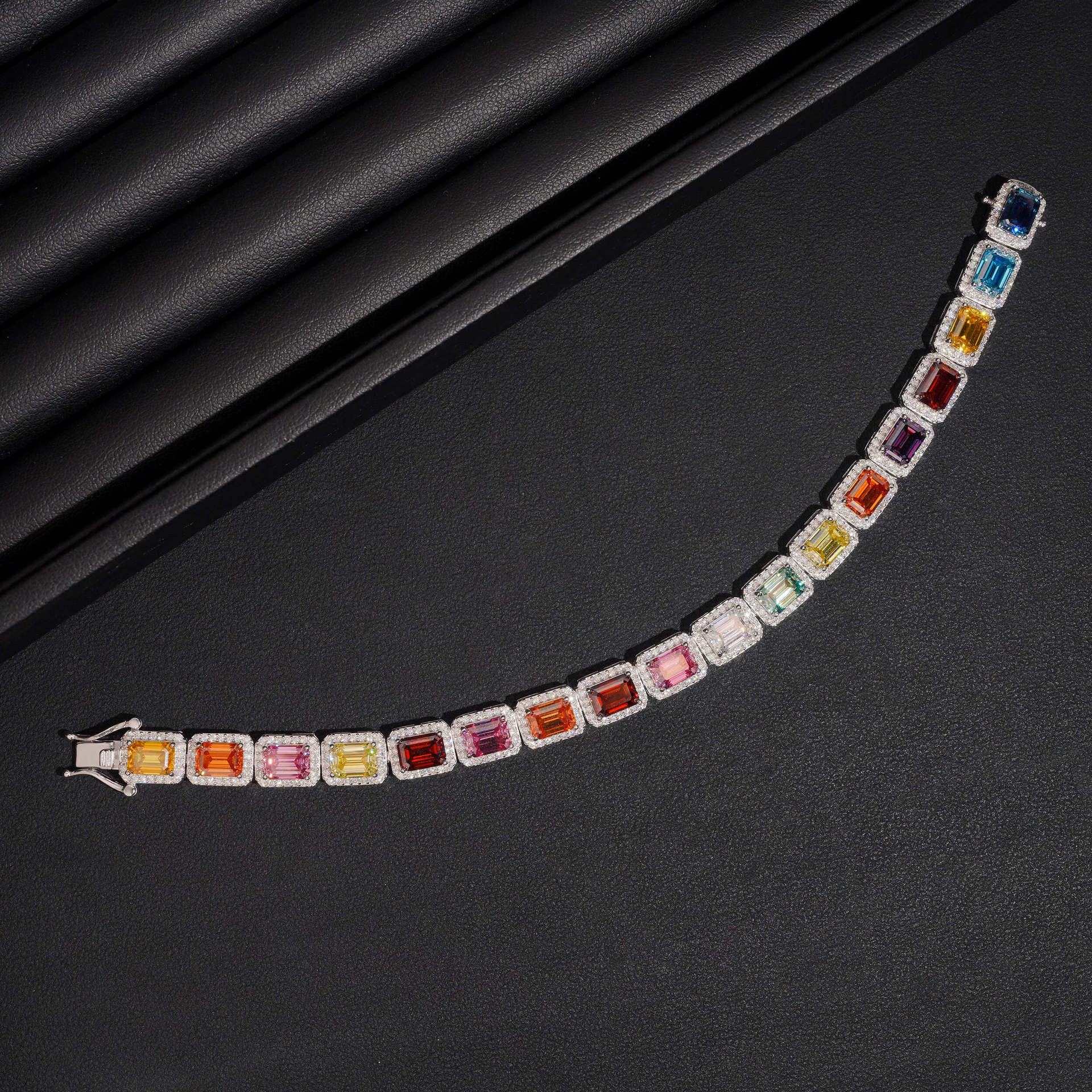 Extreme close-up of a section of the bracelet showing the individual gemstone colors and their transitions.