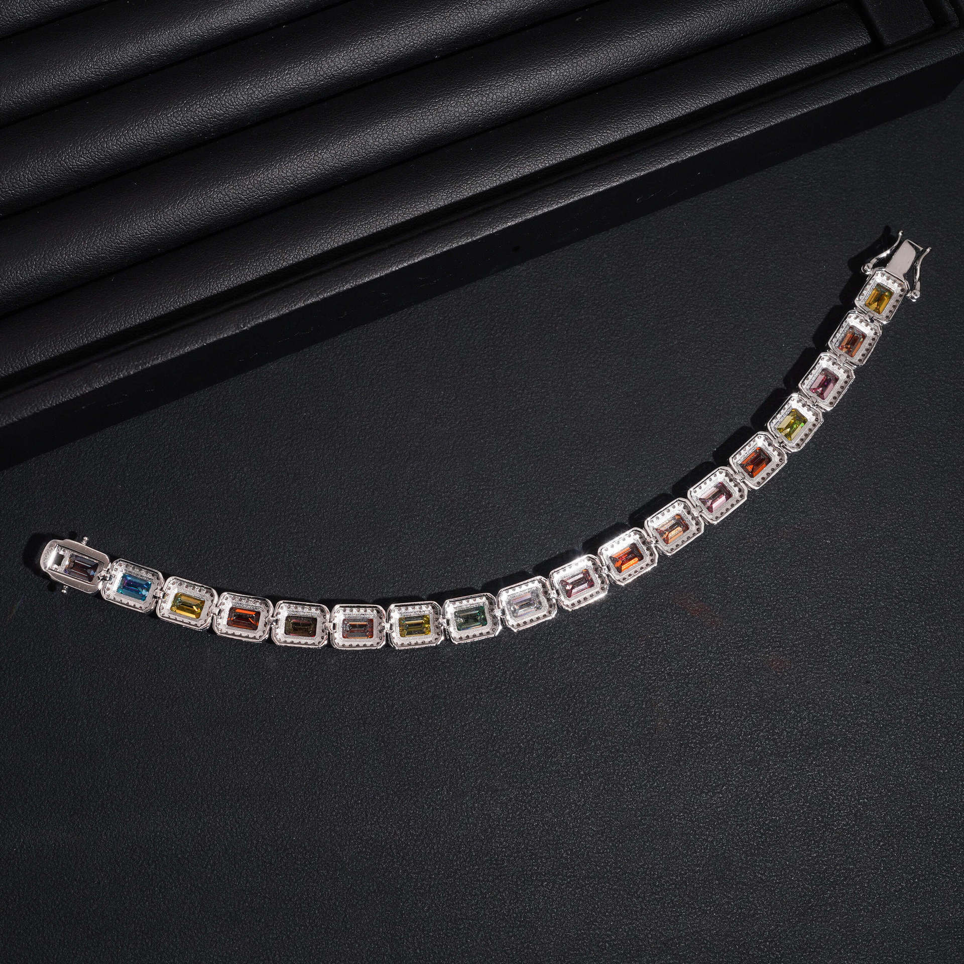Focus on the color saturation, the precision of the stone settings, and the facet brilliance of each color.