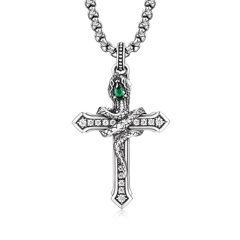 “Men’s sterling silver serpent cross necklace flat lay on white background”