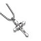 “Close-up of sterling silver serpent cross pendant with detailed craftsmanship”