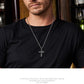 “Male model wearing serpent cross necklace in gothic masculine style”