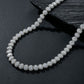 High-definition shot of the necklace laid flat and fully extended on pure white background.