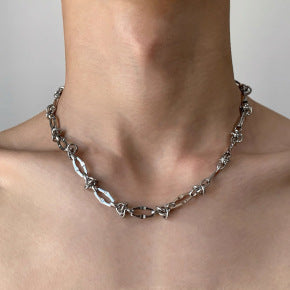 Male model wearing thorn knot Cuban silver chain