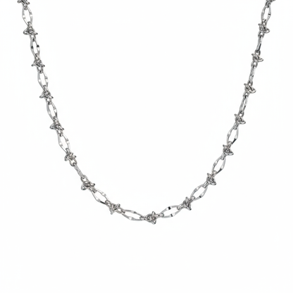 Male model wearing thorn knot Cuban silver chain