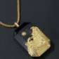 Gold pendant with intricate design on a black background