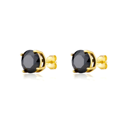 Gold earrings with black gemstones on a white background