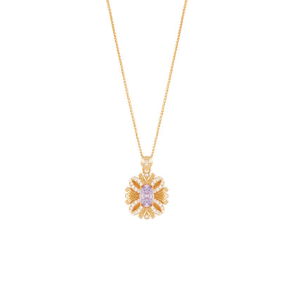 Gold necklace with a floral pendant on a white background