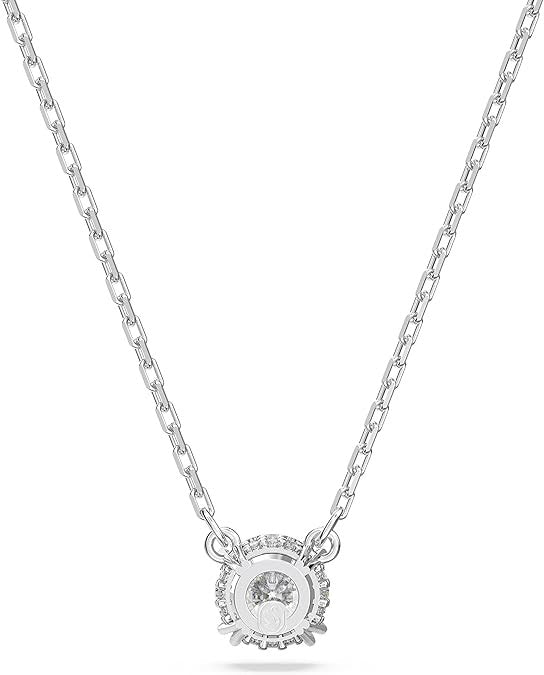 Silver necklace with a round pendant on a white background