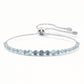 Silver bracelet with blue gemstones on a white background