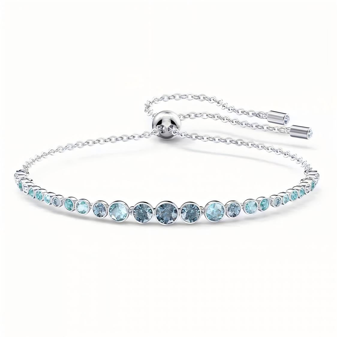 Silver bracelet with blue gemstones on a white background