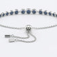Silver bracelet with blue stones on a white background