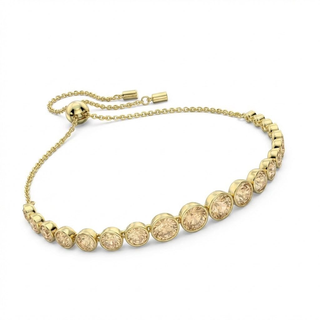 Gold bracelet with round embellishments on a white background