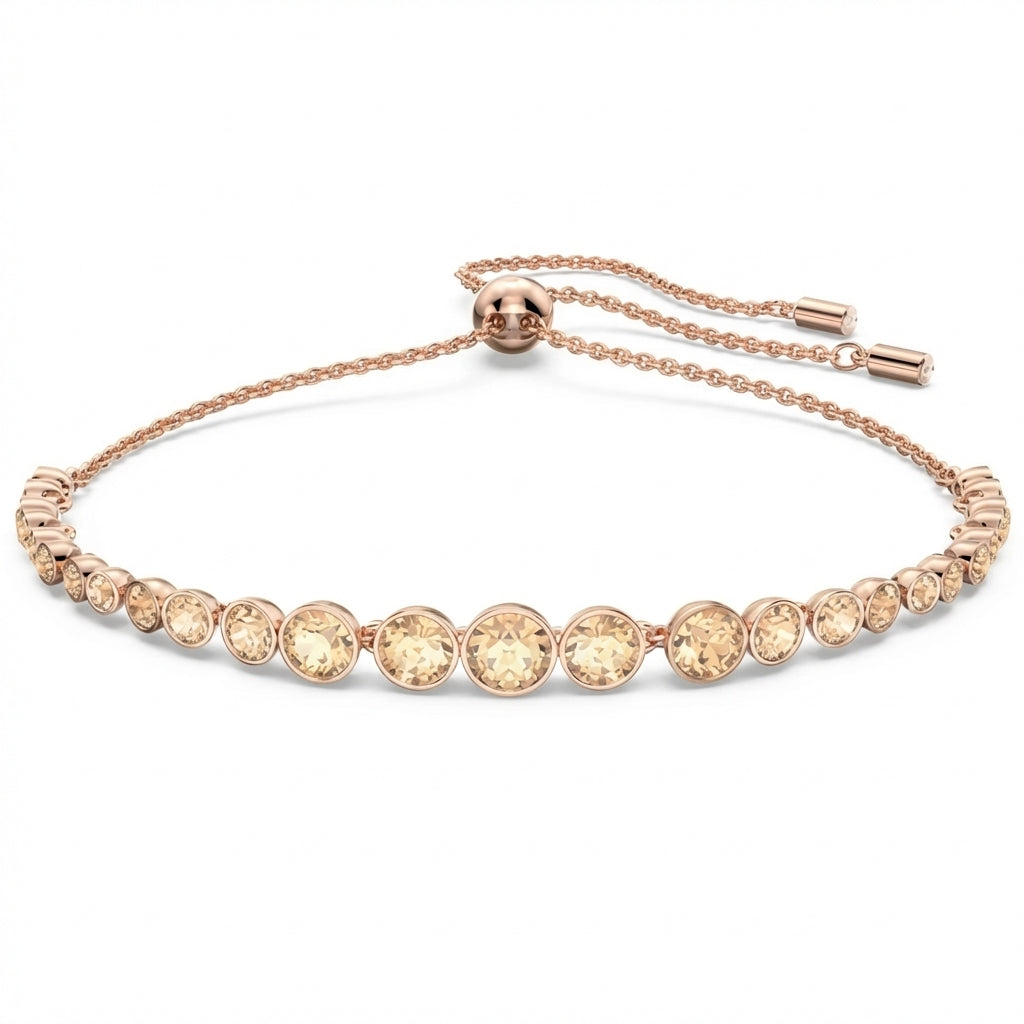 Rose gold bracelet with clear gemstones on a white background