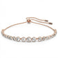 Rose gold bracelet with clear stones on a white background